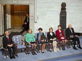 Director of the Nobel Peace Institute Geir Lundestad (R) and the Nobel Peace Prize committee (L to R) Thorbjoern Jagland, Kaci Kullmann Five, Sissel Marie Roenbeck, Inger-Marie Ytterhorn and Aagot Valle are seated beside the vacant chair reserved for the ceremony's Nobel Laureate and dissident Liu Xiaobo at the city hall in Oslo, on December 10, 2010. (Odd Andersen/AFP/Getty Images)