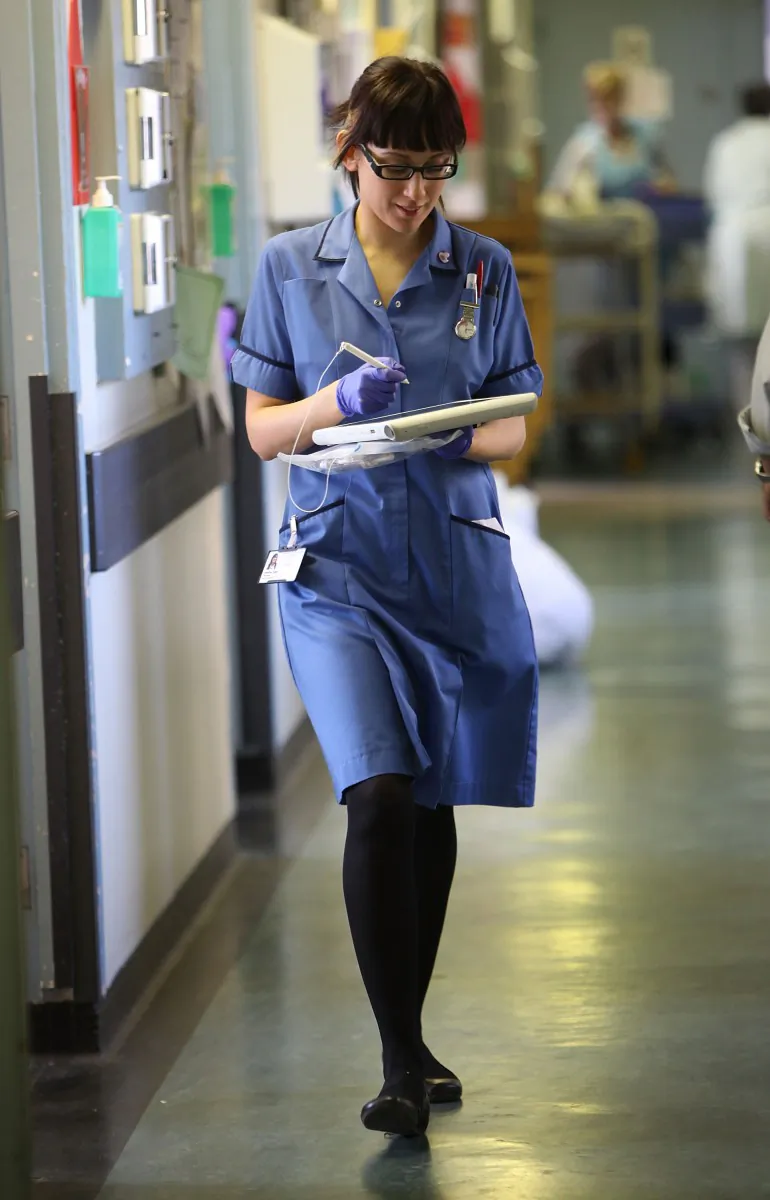 A nurse uses a wireless electronic tablet to order medicines from the pharmacy at the Queen Elizabeth Hospital in Birmingham, England. (Christopher Furlong/Getty Images)