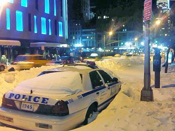 Blizzard weekend: A NYPD police car is stranded in fallen snow on 6th Ave. in Manhattan, on the evening of Monday, Dec. 27, 2010. (Jan Jekielek/The Epoch Times) Blizzard weekend: A NYPD police car is stranded in fallen snow on 6th Ave. in Manhattan, on the evening of Monday, Dec. 27, 2010. (Jan Jekielek/The Epoch Times)