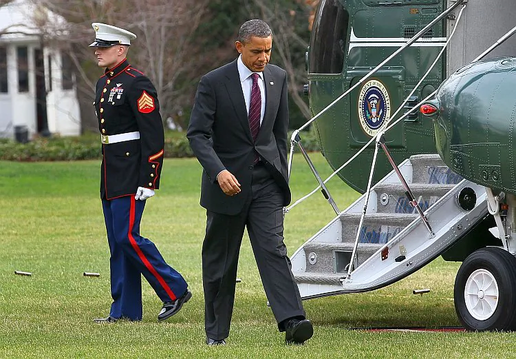 U.S. President Barack Obama (2nd R) arrives back at the White House, on December 20, 2011 in Washington, DC. Obama signed into law the controversial National Defense Authorization Act (NDAA) on Saturday. (Mark Wilson/Getty Images)
