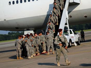 Leaving Iraq: Paratroopers deplane from their year-long tour in Iraq with the U.S. Army's 82nd Airborne Division July 30, 2010 in Fort Bragg, N.C. Over 300 paratroopers in the 1st Brigade of the storied 82nd Airborne returned to their families, who waited (Chris Hondros/Getty Images)