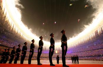 Members of the Chinese military stand at attention during the opening ceremony for the Beijing Olympics at the National Stadium on August 8, 2008. (Phil Walter/Getty Images)