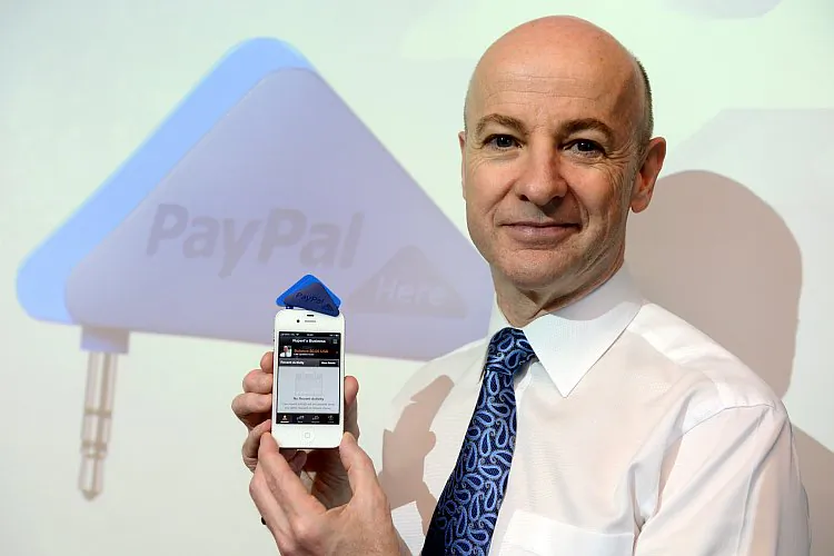 Senior vice president of Asia Pacific for Paypal, Rupert Keeley, poses for a picture with Paypal's triangle-shaped smartphone payment dongle called PayPal Here in Hong Kong, on March 16. (Aaron Tam/AFP/Getty Images)