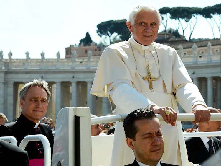 Paolo Gabriele (bottom), the pope's butler, sits in the popemobile with Pope Benedict XVI and Monsignor Georg Ganswein (L), Benedict's private secretary as they arrive in St. Peter's square on April 18 for the pope's weekly general audience. (Vincenzo Pinto/AFP/GettyImages)
