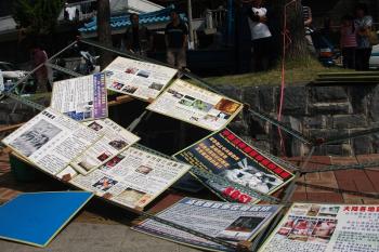 Posters torn down by pro-communist men -- a reenactment of last year's violence in Flushing, New York. (The Epoch Times) Posters torn down by pro-communist men -- a reenactment of last year's violence in Flushing, New York. (The Epoch Times)