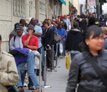 People line up to receive a free meal at the St. Anthony foundation dining room in San Francisco, California. The U.S. poverty rate increased to a 14.3 percent in 2009, the highest level since 1994. (Justin Sullivan/Getty Images)