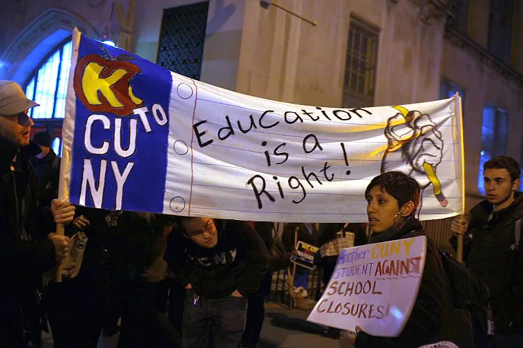 People protest outside during a Panel for Educational Policy meeting at Brooklyn Tech High School in New York City on Feb. 9, before a vote on whether to close or partially close 23 schools that the Department of Education considers failing. Members of Occupy Wall Street joined teachers, parents, and concerned residents to protest against the proposed closings. Critics say Mayor Michael Bloomberg should be fixing the city's schools, not closing them. (Spencer Platt/Getty Images)