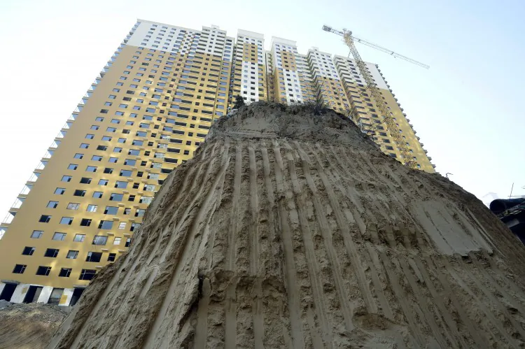 A grave mound 10 meters high at a construction site in a village in Taiyuan, north China's Shanxi Province, Dec. 6. Real estate developers in China are stuck with enormous inventories and no easy way in sight to offload them and avoid losses. (STR/AFP/Getty Images)