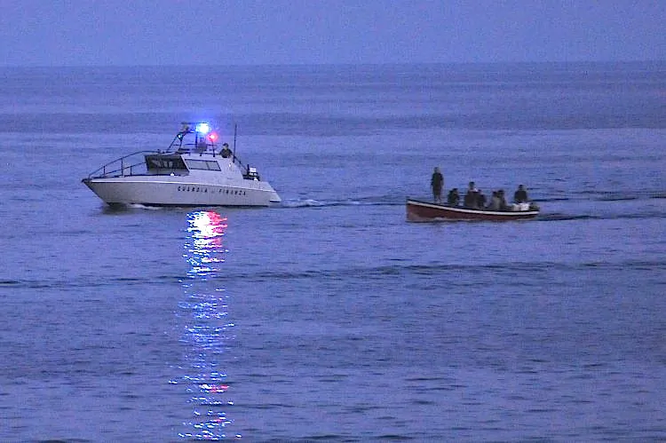 A boat carring migrants arrives in the port of the Italian island of Lampedusa on Aug. 23, 2011. Italy was found guilty by the European Court of Human Rights on Thursday of violating the rights of assylum-seekers by returning them to Libya without hearing their cases. (Tullio M. Puglia/Getty Images)