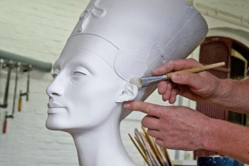A replica of the 3,500-year-old bust of Egyptian Queen Nefertiti is cleaned by sculptor Wolfgang Zuehlke. One hundred limited-edition busts will be made and sold for over 2,500 euros each. (John Macdougall/AFP/Getty Images) A replica of the 3,500-year-old bust of Egyptian Queen Nefertiti is cleaned by sculptor Wolfgang Zuehlke. One hundred limited-edition busts will be made and sold for over 2,500 euros each. (John Macdougall/AFP/Getty Images)