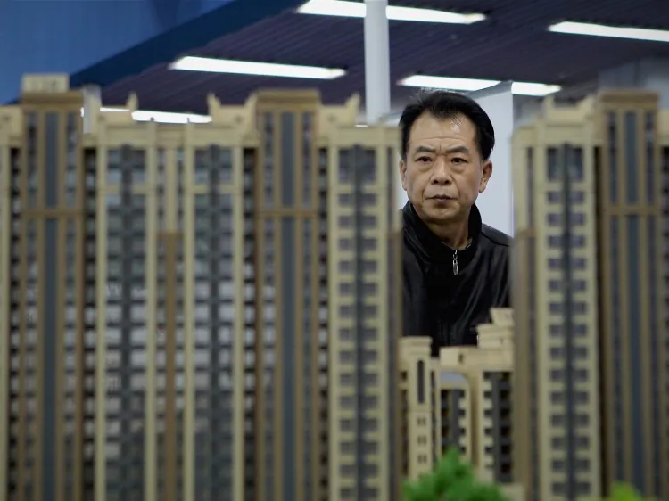 A potential buyer visits the 2011 Beijing Spring Real Estate Trade Fair on April 9, 2011 in Beijing. Officials with real estate whose provenance may not hold up under scrutiny are now hurriedly selling off their holdings, according to recent reports. (Lintao Zhang/Getty Images)