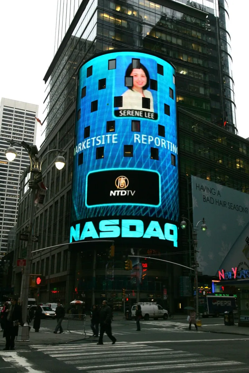 Serene Lee and the New Tang Dynasty Television corporate logo on NASDAQ's MarketSite in Times Square in 2007—before NASDAQ unfriended the station at the behest of the Chinese Communist Party. (New Tang Dynasty Television)