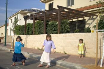Young children play in a neighborhood in the West Bank settlement of Karnei Shomron. Some are concerned that a building freeze will hinder compensating for natural growth. (Genevieve Long/The Epoch Times) Young children play in a neighborhood in the West Bank settlement of Karnei Shomron. Some are concerned that a building freeze will hinder compensating for natural growth. (Genevieve Long/The Epoch Times)