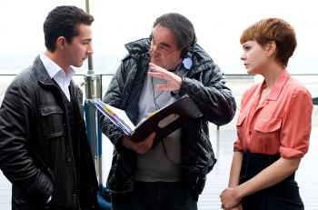 ON THE SET: Director Oliver Stone (center) sets up a scene with his actors Shia LaBeouf (L) and Carey Mulligan. (Barry Wetcher/SMPSP/Twentieth Century Fox) ON THE SET: Director Oliver Stone (center) sets up a scene with his actors Shia LaBeouf (L) and Carey Mulligan. (Barry Wetcher/SMPSP/Twentieth Century Fox)
