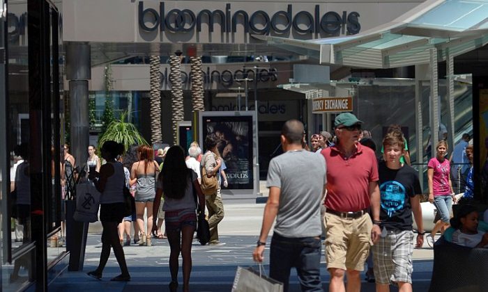 Shoppers walk through the Santa Monica Place mall on Aug. 17, in Santa Monica, Calif. Consumer sentiment unexpectedly rose in September to the highest level since February, according to a survey published by the Conference Board. (Kevork Djansezian/Getty Images)