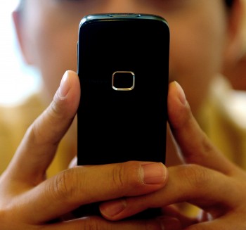 NEW APP: A new smartphone app could help people file insurance claims. ( Frank Lee/AFP/Getty Images)