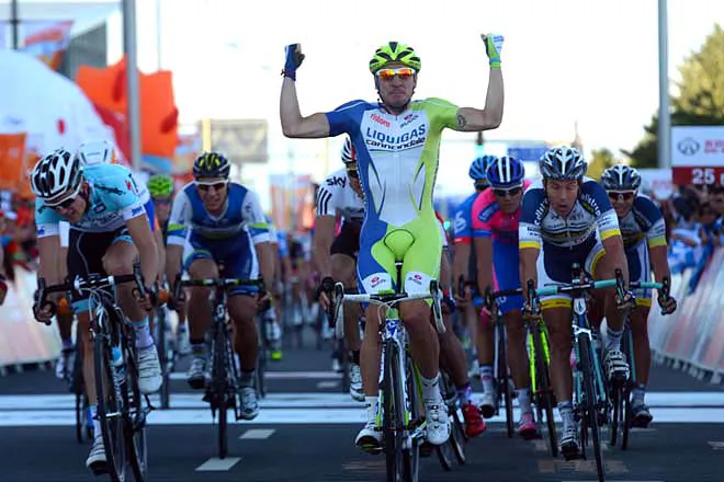 Liquigas sprinter Elia Viviani crosses the finish line a meter ahead of his rivals to win Stage One of the 2012 Tour of Beijing. (tourofbeijing.net)