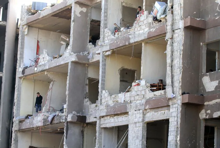 The damage to a partially built building is seen following twin bomb attacks on security buildings in the capital Damascus on March 17. The Syrian Army has launched new attacks around the country, local activists said on Wednesday.(Louai Beshara/AFP/Getty Images)