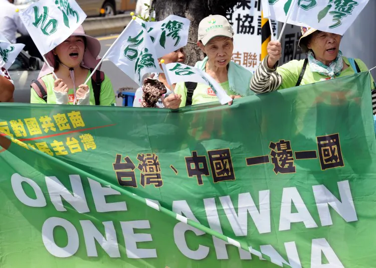 Anti-China demonstrators displays banners reading "one Taiwan, one China " in Taipei on August 8. Taiwanese have a poor impression of mainland Chinese people, the Chinese government, and its human rights record, according to a new survey. (Sam Yeh/AFP/Getty Images)