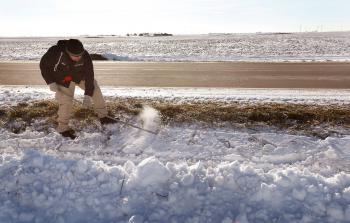 Investigators search the crash site for clues in the disappearance of Tanya Shannon on December 7 near Seneca, Illinois. Shannon has not been seen since she and her husband Dale left a holiday party together Saturday evening. (Scott Olson/Getty Images)