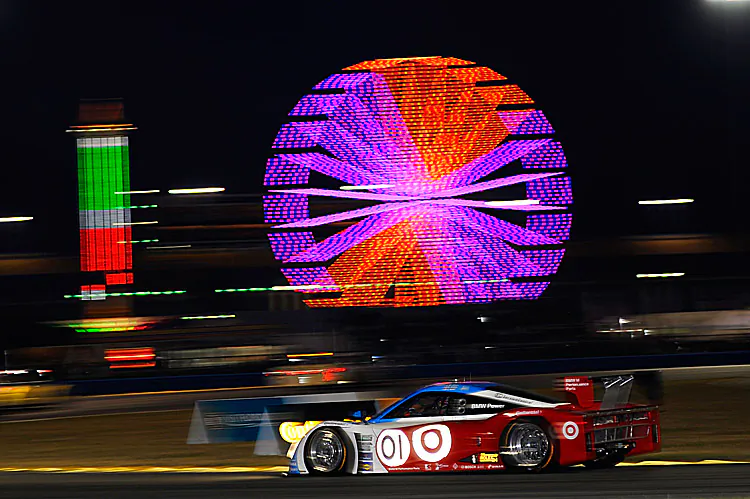 The #01 Telmex-Ganassi of Scott Pruett was second and closing on its sister car, the #02, just after nine hour into the 2012 Rolex 24 at Daytona. (John Harrelson/Getty Images)