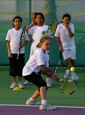 Children learning to play tennis. A recent report says more than 80 percent of Canadians believe that “promoting positive values in youth should be a priority for sport in Canada.” (Brunskill/Getty Images)