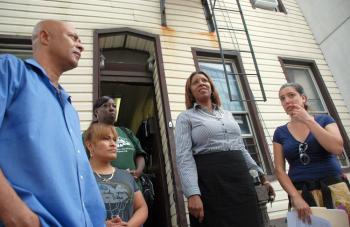 Council member Letitia James (2R) stands with tenants and Pratt Area Community Council members in front of 71 Grand Ave. in Brooklyn.  (Helena Zhu/The Epoch Times)