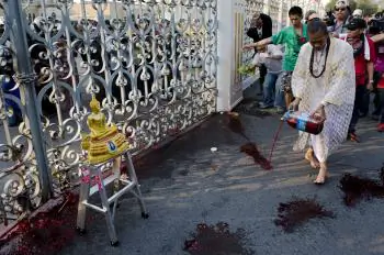 Red Shirt Protesters Spill Blood on Thai Government House