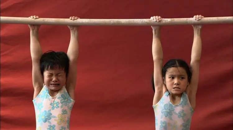PAINFUL TRAINING: A scene from the film “The Red Race,” which documents the grueling training required for young gymnasts in China. The training includes humiliation, harsh criticism, and constant pressure to become champions. (Courtesy of Chao Gan/Red Race)