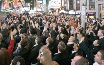 Excited viewers follow the election results on a screen at Times Square on Election Day. (Edward Dai/Epoch Times)