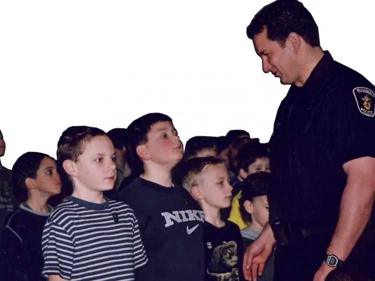 Rock Solid founder Cpl. Tom Woods, seen here with elementary school children, was instrumental in developing WITS into a program to help kids deal with bullying. The RCMP have partnered with University of Victoria researchers in a pilot WITS program. (Rock Solid Foundation)