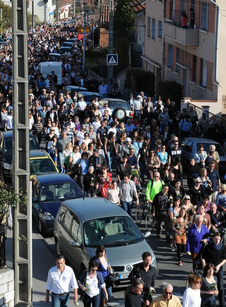 People from all faiths march on March 25 in the southwestern city of Toulouse, in the district where three children and one teacher were killed last week by self-proclaimed Islamist Mohamed Merah. (Eric Cabanis/AFP/Getty Images)