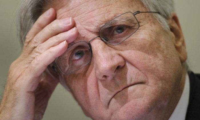 Former European Central Bank chief Jean-Claude Trichet gestures during a press conference in this file photo from last year. Trichet is also a member of the board of directors for the Bank for International Settlements (BIS). BIS was very critical of central banks in its recent report, in an effort to prevent another financial crisis. (FABRICE COFFRINI/AFP/Getty Images)