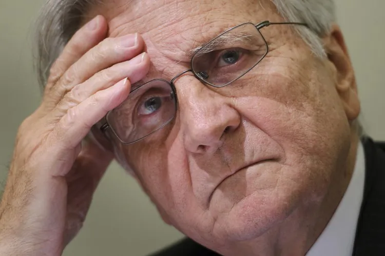 Former European Central Bank chief Jean-Claude Trichet gestures during a press conference in this file photo from last year. Trichet is also a member of the board of directors for the Bank for International Settlements (BIS). BIS was very critical of central banks in its recent report, in an effort to prevent another financial crisis. (FABRICE COFFRINI/AFP/Getty Images)