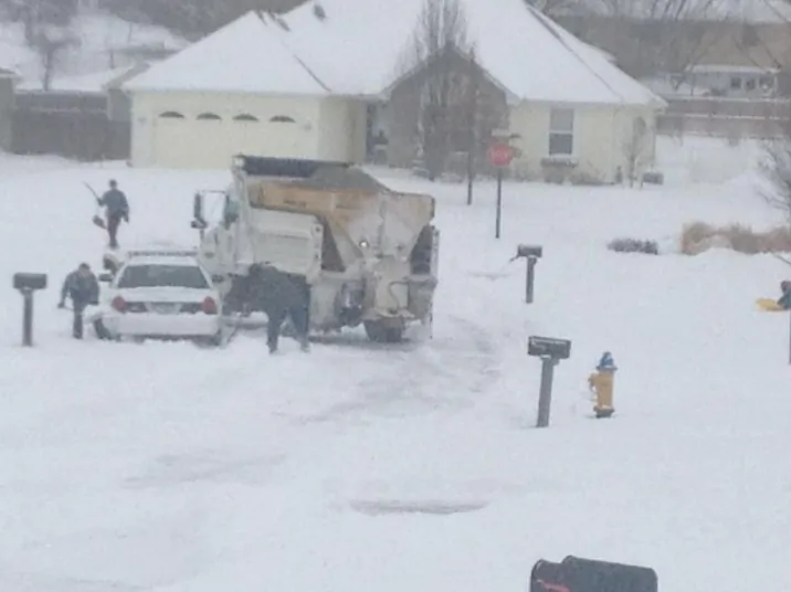 A car is stuck in the snow on February, 21, 2013 after a giant snowstorm covered the city . (Photo Courtesy of the Kansas Highway Patrol)