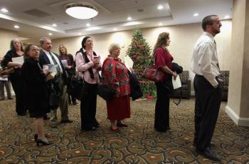 Job seekers stand in line at a career fair December 2, 2010 in Denver, Colorado. (John Moore/Getty Images)