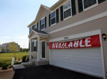 A home is offered for sale in Wauconda, Illinois. The U.S. housing market is expected to lose $1.7 trillion in market value in 2010 (Scott Olson/Getty Images)