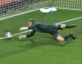 BIG MISTAKE: England's Robert Green sees the ball slip through his hands and into the net. (Martin Rose/Getty Images)