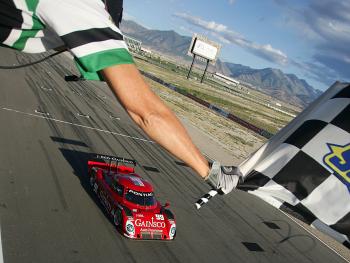 Alex Gurney takes the checkered flag to win the Utah 250. (Brian Cleary/Getty Images) Alex Gurney takes the checkered flag to win the Utah 250. (Brian Cleary/Getty Images)