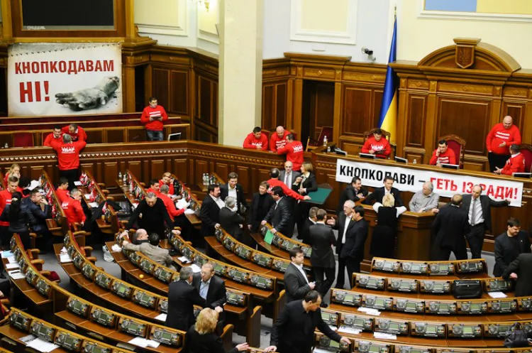 Ukraine's Parliamentary assembly hall is strung with banners denouncing the practice of double voting during a session on Feb. 5, 2013. (Vladimir Borodin/The Epoch Times)