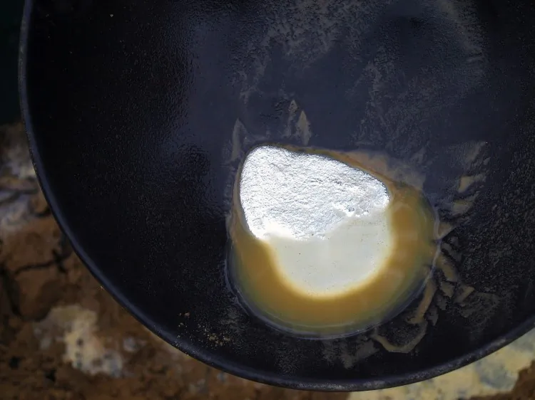A gold miner heats an amalgam to evaporate the mercury and keep the gold in the Delta Uno camp, in the region of Madre de Dios, southeast of Lima, Peru, in the forest bordering Brazil on Nov. 16, 2009. (Dan Collyns/AFP/Getty Images)