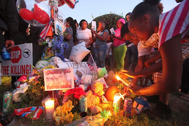 Supporters gather during a candelight vigil at a memorial to Trayvon Martin outside The Retreat at Twin Lakes community where Trayvon was shot and killed by George Michael Zimmerman while on neighborhood watch patrol in Sanford, Florida. (Mario Tama/Getty Images)