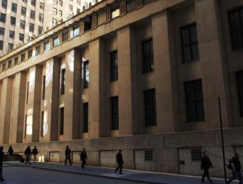 People walk towards Wall Street in the financial district in New York City. The U.S. Securities and Exchange Commission has expanded the number of stocks subject to its circuit breakers rule. (Spencer Platt/Getty Images)