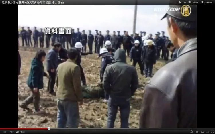 A photograph taken by a witness of the incident in Panjin City, Liaoning Province, where a farmer, Wang Shujie, was shot and killed by police after he disputed the expropriation of his land. Locals were shocked at the raw violence of the police. (NTD Television)