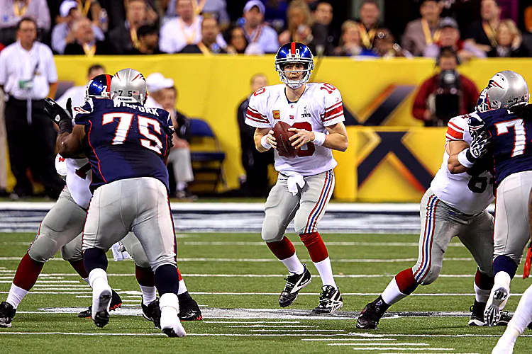 Tom Brady (12) was called for an intentional grounding in the end zone on the Patriots’ first play. (Gregory Shamus/Getty Images)
