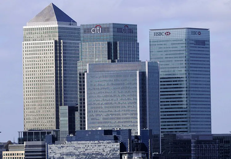 The photo shows a view of Canary Wharf, including the headquarters of British banks Barclays (L) and HSBC (R), in east London, Sept. 12. Canary Wharf is London's main financial center where many banks have established offices. (Facundo Arrizabalaga/AFP/Getty Images)