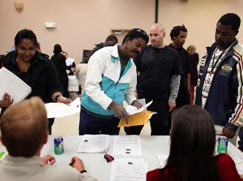 People look for work as they attend the Village at Gulfstream Park job fair on January 12, 2010 in Hallandale, Florida. (Joe Raedle/Getty Images)