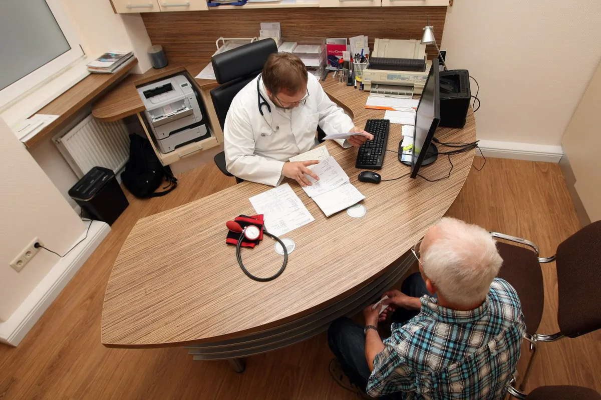 A doctor speaks to a patient in Berlin, Germany, on Sept. 5, 2012. (Adam Berry/Getty Images)