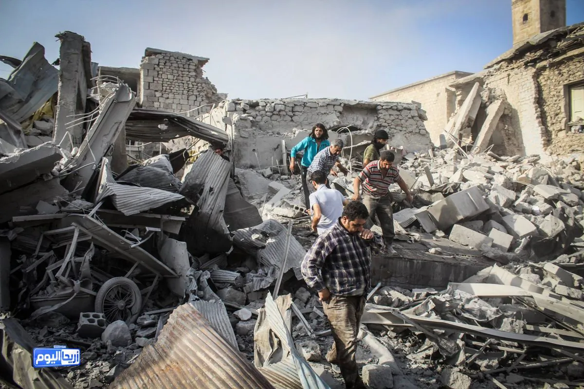 This photo provided by the Syrian anti-government activist group Ariha Today, which has been authenticated based on its contents and other AP reporting, shows Syrian citizens looking for survivors after a government warplane crashed in the center of the town of Ariha, in the northwestern province of Idlib, Syria, Monday, Aug. 3, 2015. Air raids and the subsequent crash of a Syrian warplane in a residential area in the northwestern town of Ariha on Monday killed and wounded dozens of people, two activist groups said. (Ariha Today via AP)