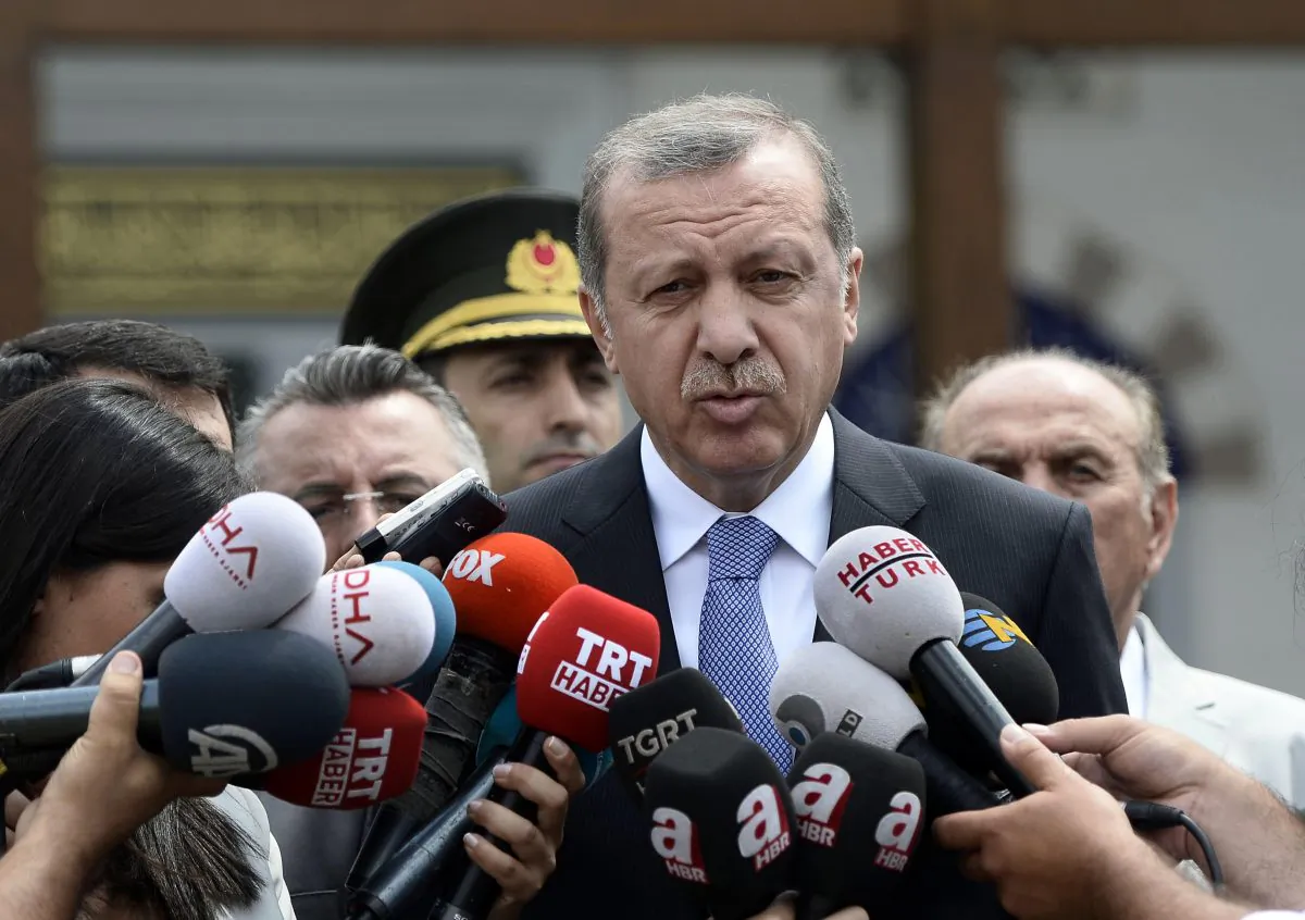 Turkish President Recep Tayyip Erdogan speaks to the media in front of a mosque in Istanbul, Turkey, on July 24, 2015. In a major tactical shift, Turkish warplanes struck Islamic State targets across the border in Syria on July 24, Turkish officials announced—a move that came a day after ISIS militants fired at a Turkish military outpost, killing a soldier. In a related, long-awaited development, Erdogan confirmed that Turkey had agreed to let the United States use a key base in southern Turkey for military operations against the militants “within a certain framework.” (Depo Photos/AP)